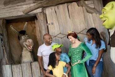 Family meeting Shrek characters inside DreamWorks Land at Universal Orlando Resort.