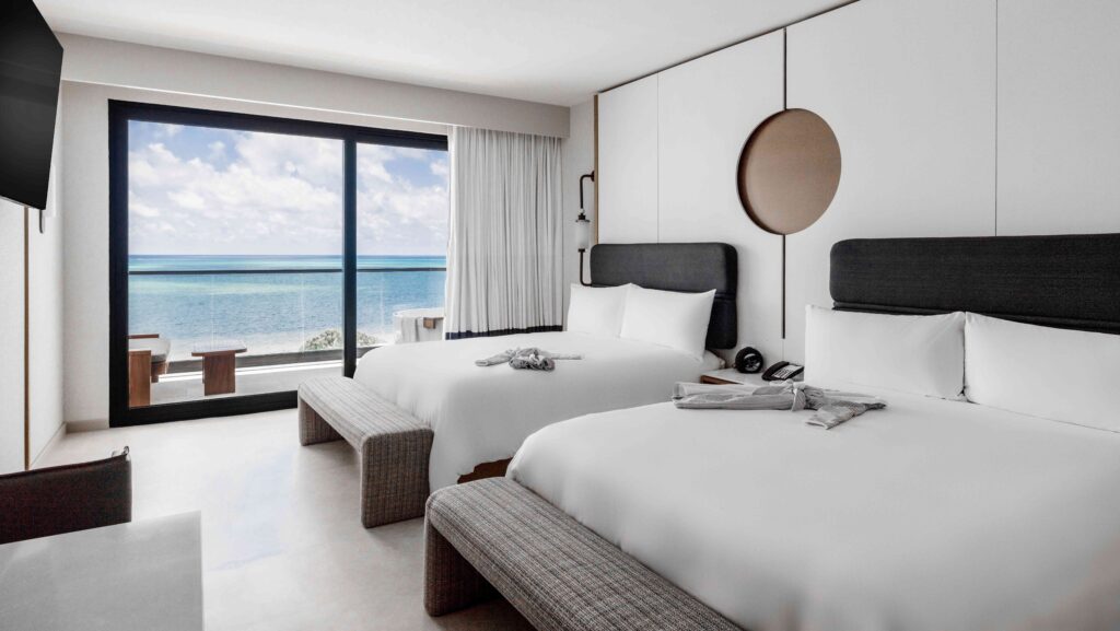 A standard guest room at AVA Resort Cancun