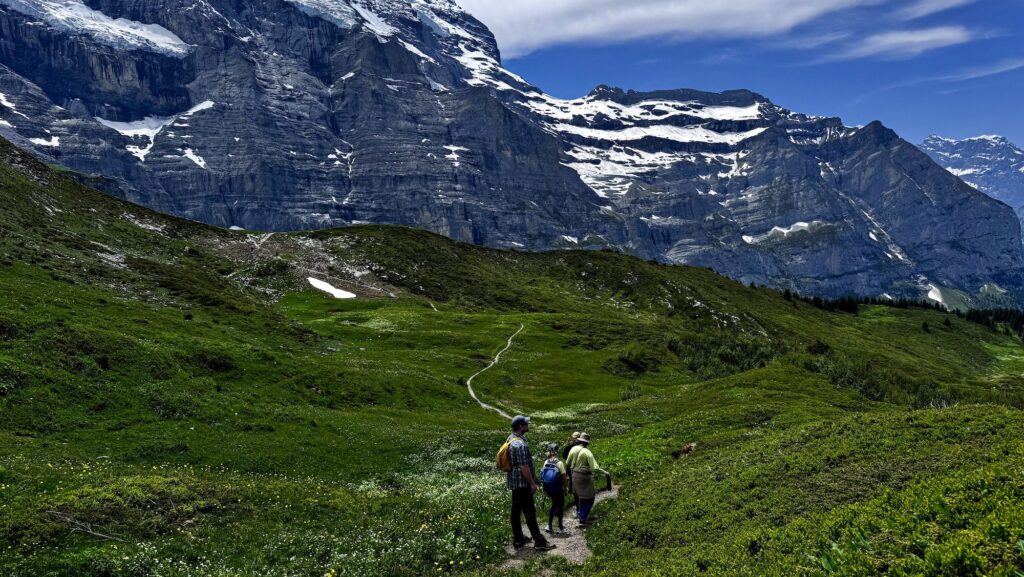 family hiking in the Jungfrau region of the Alps in Switzerland