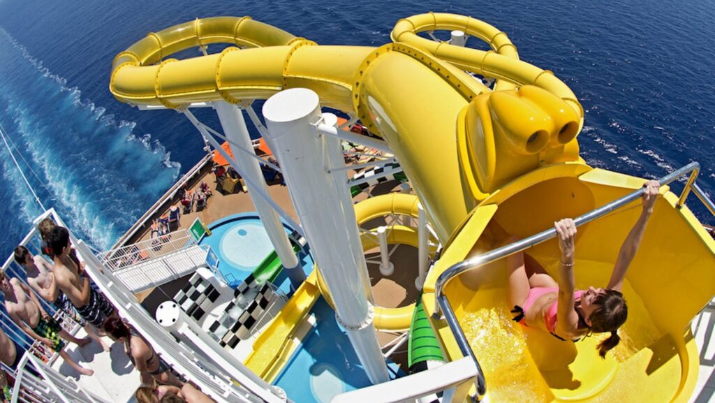 Person going down a water slide on a cruise.