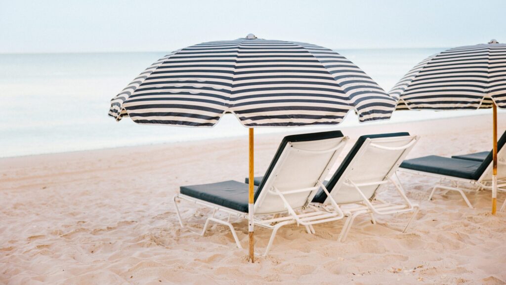 Striped umbrellas and lounge chairs on the beach