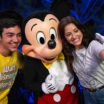 Guests with Mickey Mouse at Walt Disney World