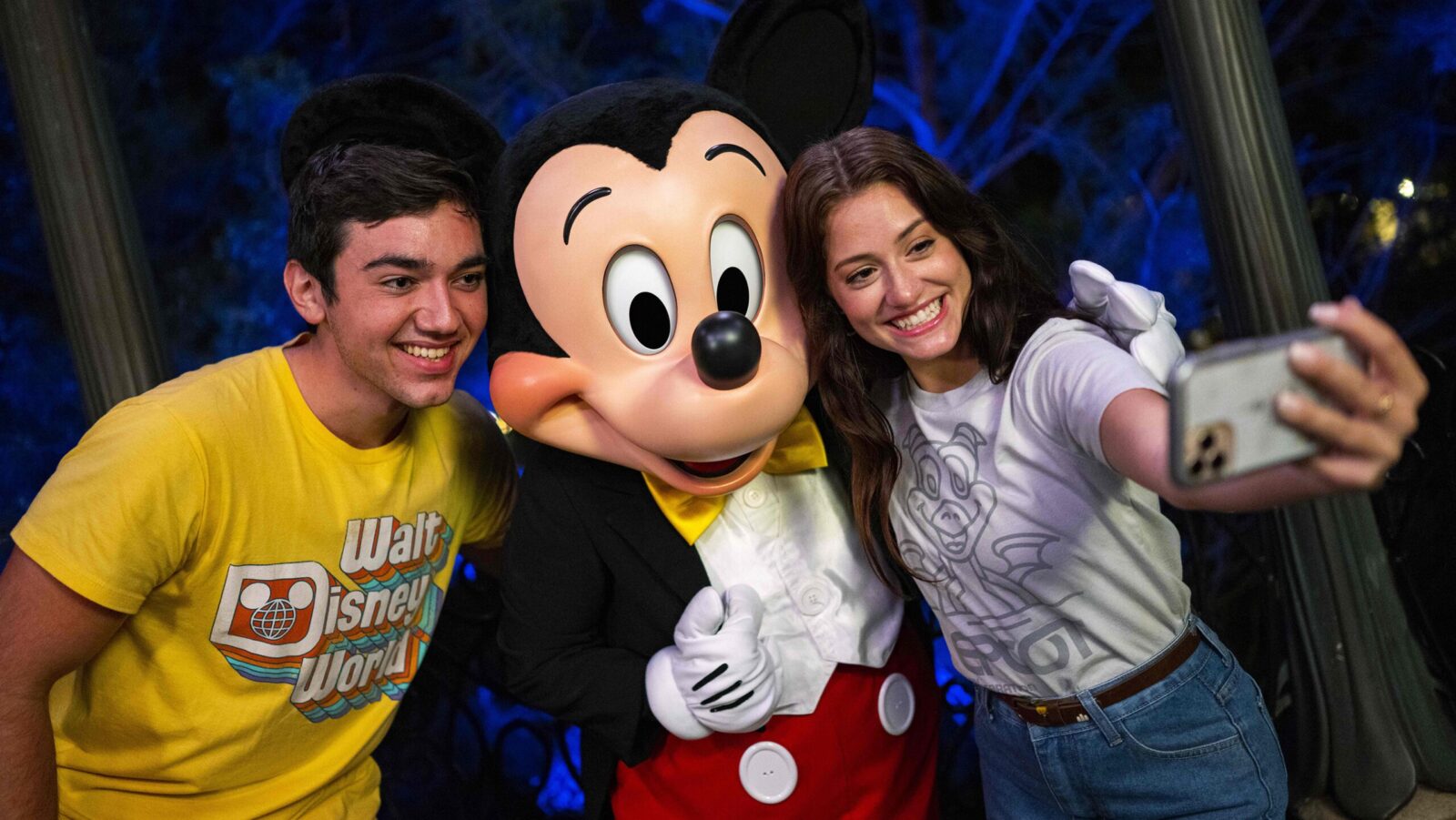 Guests with Mickey Mouse at Walt Disney World