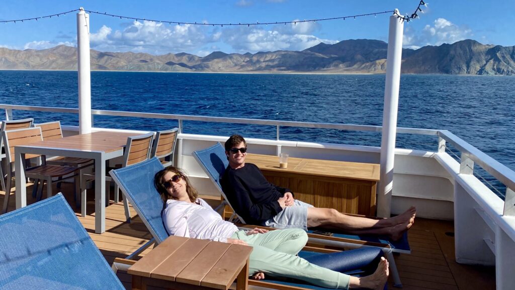 Alec and Allison Tibaldi relaxing on The Venture, a Lindblad expedition ship