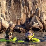 Alec and Allison Tibaldi snorkeling on an mother-son expedition cruise