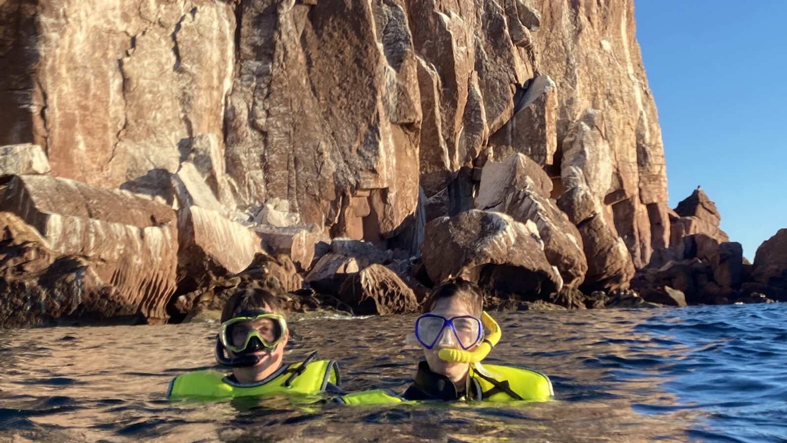 Alec and Allison Tibaldi snorkeling on an mother-son expedition cruise