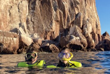 Alec and Allison Tibaldi snorkeling on an mother-son expedition cruise