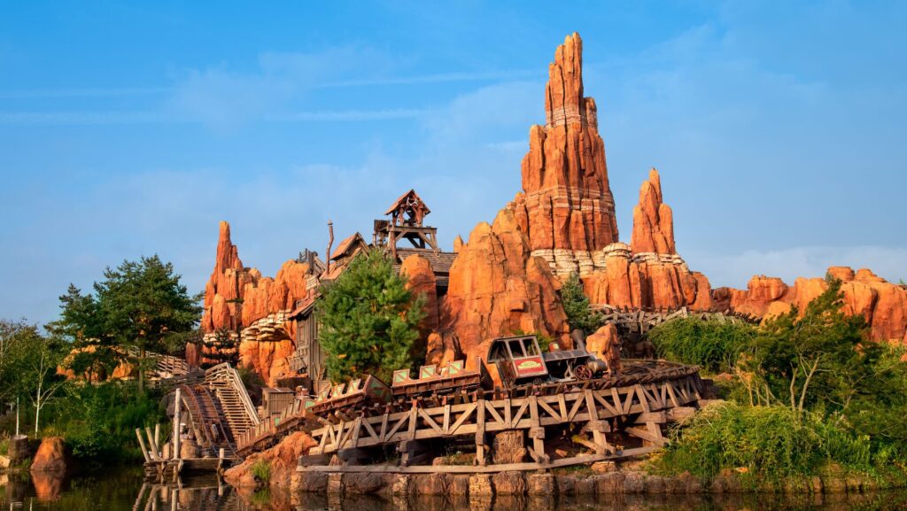 Red rocks of Thunder Mountain towering into the blue sky at Disneyland Paris