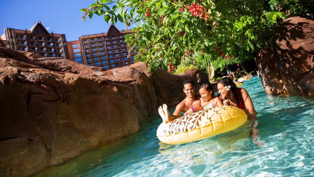 Family in the lazy river at Disney Aulani resort