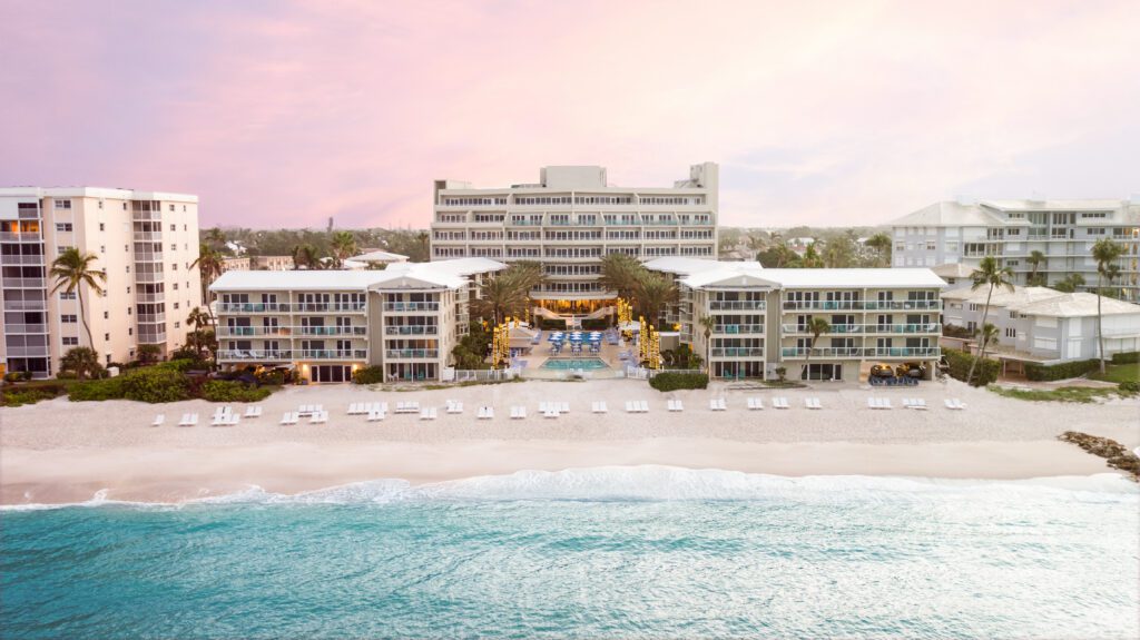 A sunrise aerial view of Edgewater Beach Hotel and the beach in front of it