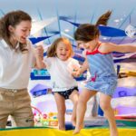 care giver playing with toddlers on an MSC cruise