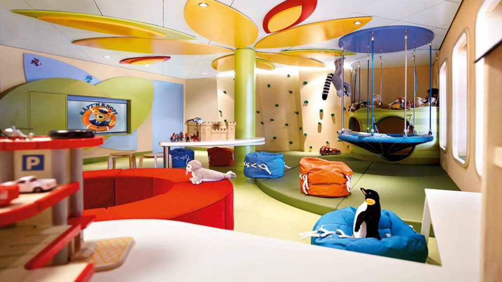 Children's club with swing, bean bag chairs, circular bench, and toys