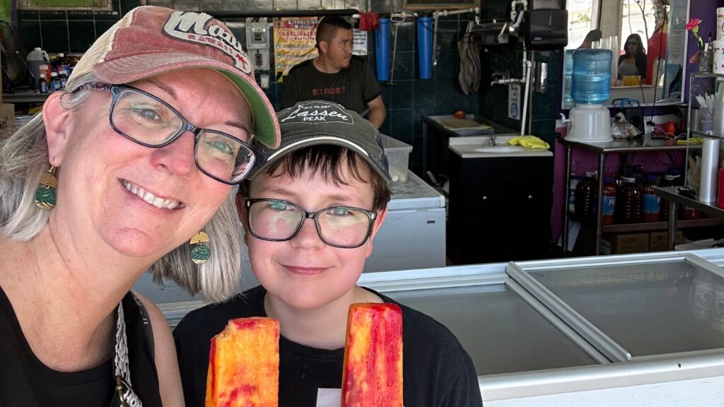 mother and child posing with paletas on a food tour of Puerto Vallarta