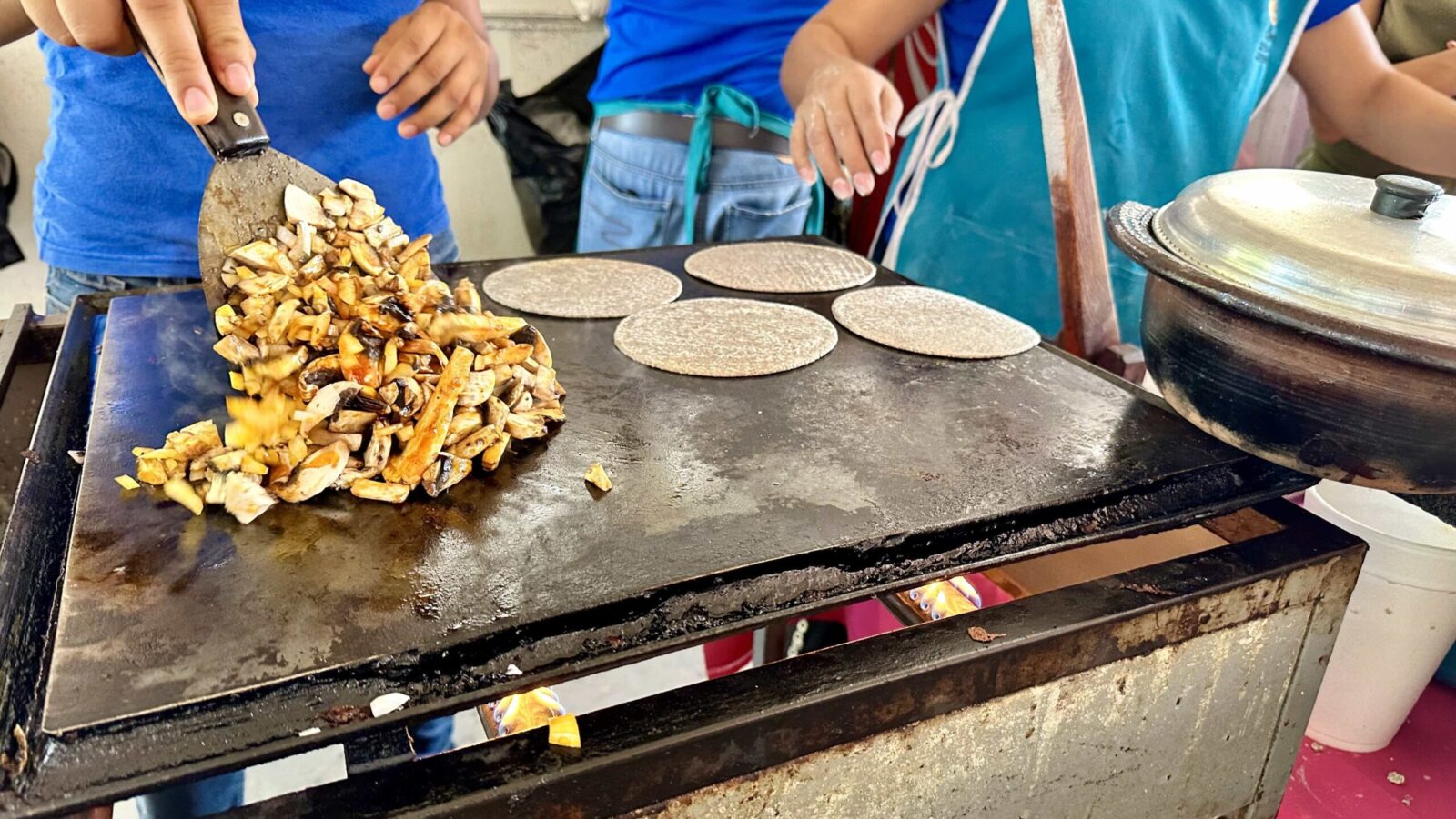 tacos being cooked at a taco stand in Puerto Vallarta on a food tour