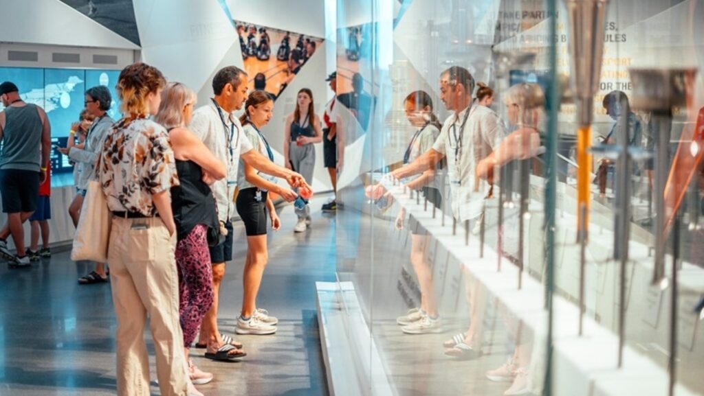 Visitors looking at exhibits at the U.S. Olympic & Paralympic Museum