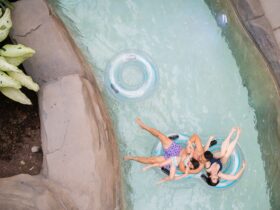 A family floating in the lazy river at Kartrite Resort