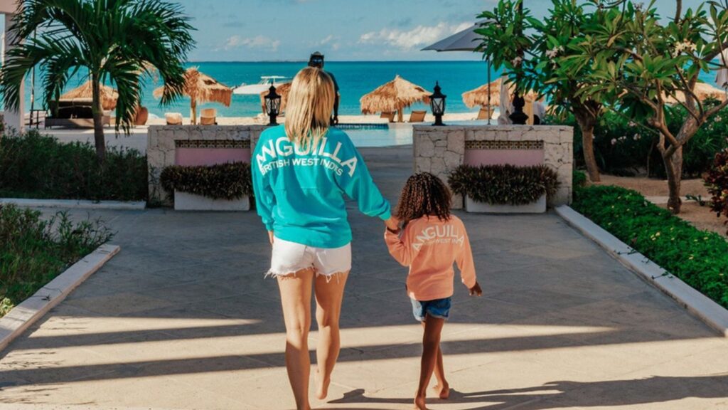 adult and child walking at 
 Frangipani Beach Resort