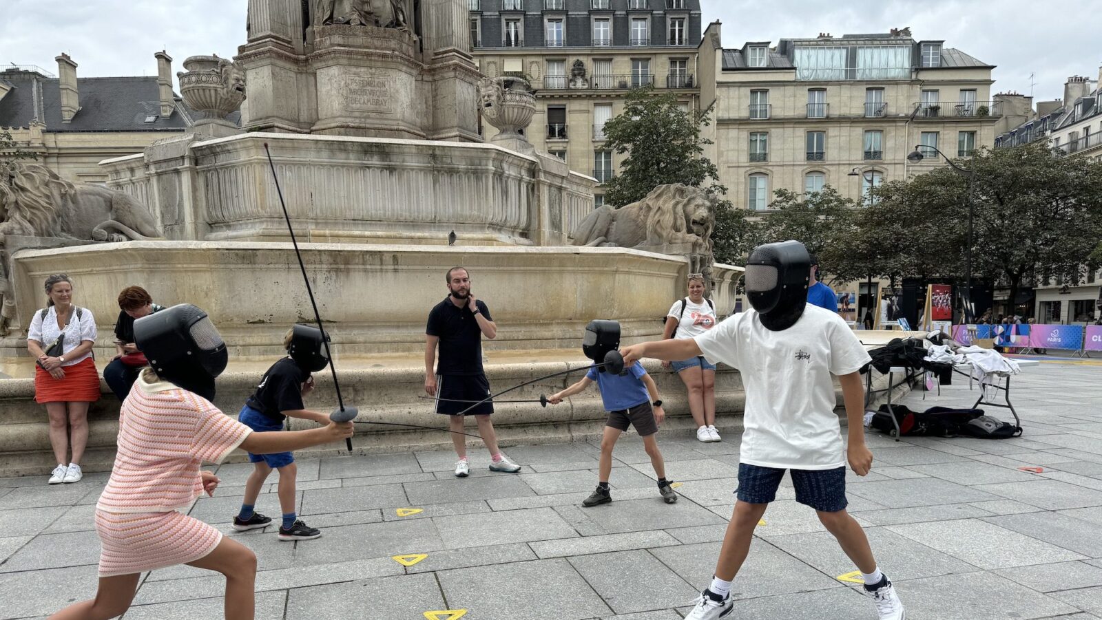 spectators fencing in front of St Sulpice during the Paris Summer Olympics