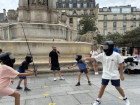 spectators fencing in front of St Sulpice during the Paris Summer Olympics