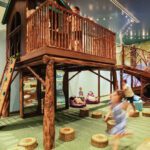 Kids running around a treehouse play structure inside a building