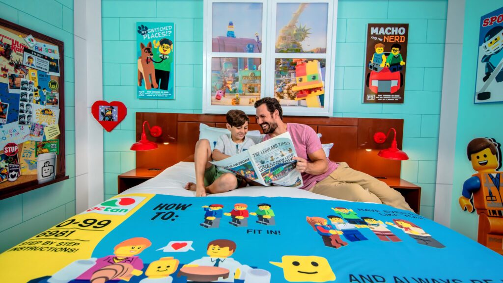 Parent and child on bed at LEGOLAND Hotel