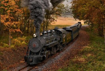 An East Broad Top Railroad train travels through fall foliage