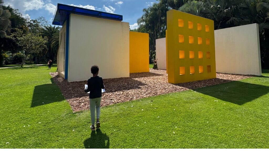 child looking at art at Inhotim Art Museum in Brazil