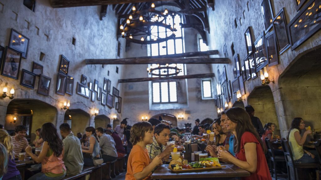 People eating at the Leaky Cauldron at Diagon Alley