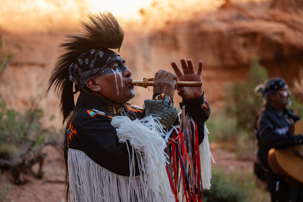 Navajo, or Diné, members at an evening cookout and musical experience in Monument Valley (Photo: Adventures by Disney)