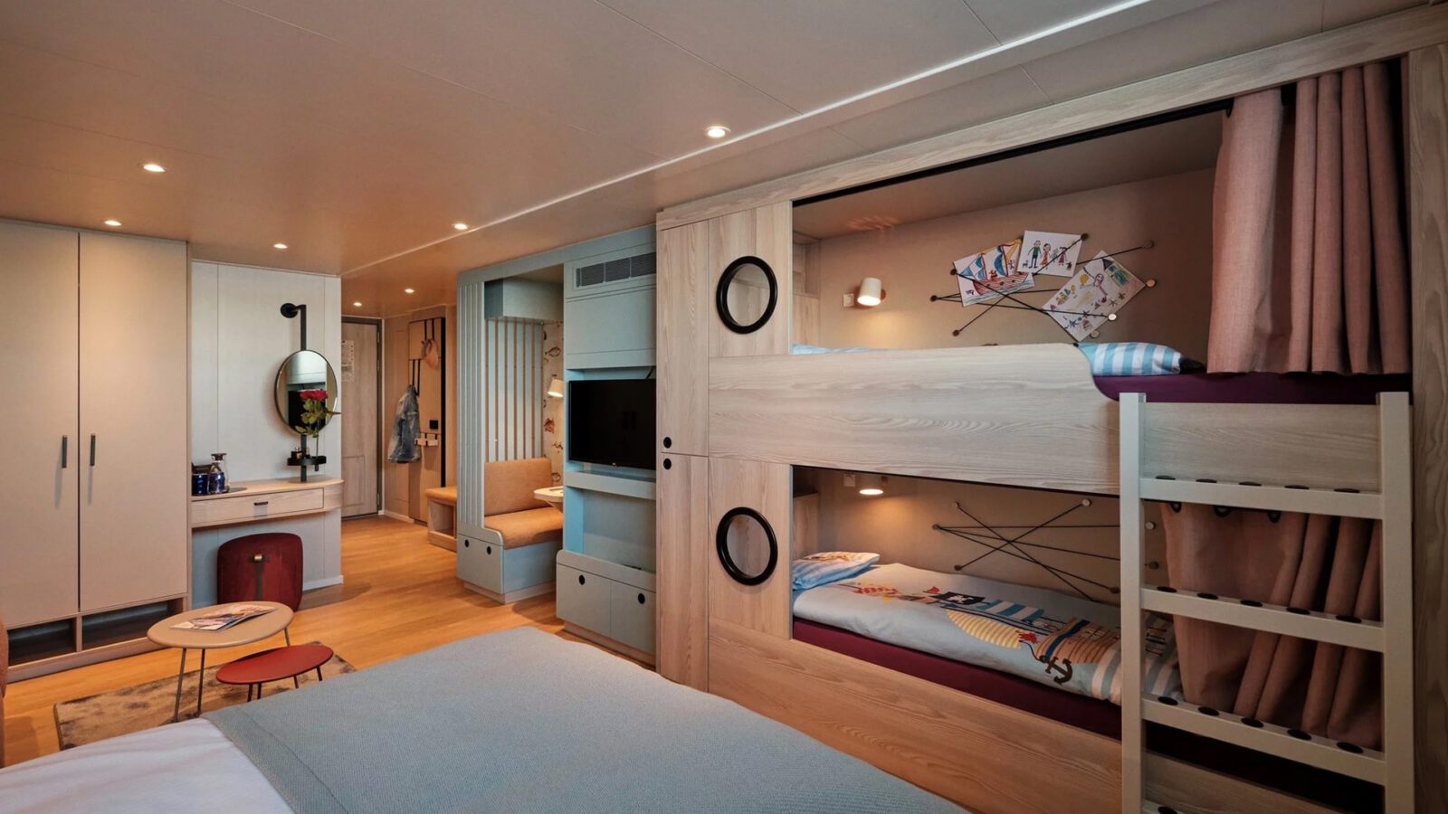 Cruise ship cabin with bunk beds built into the wall