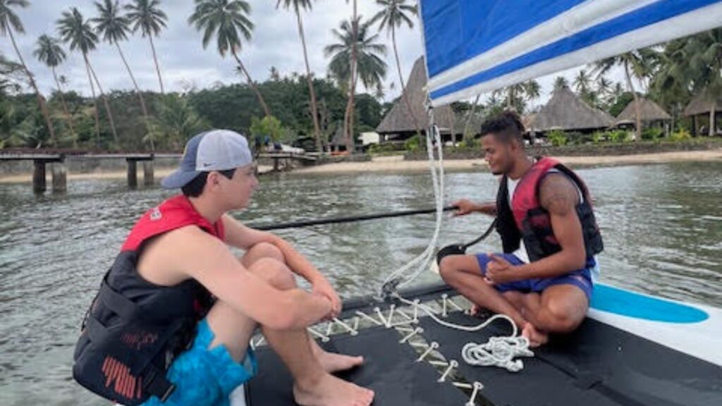 Bula Buddies at Jean-Michel Cousteau Resort on boat with teen