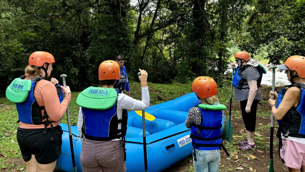 child and adults getting ready to white water raft in Costa Rica