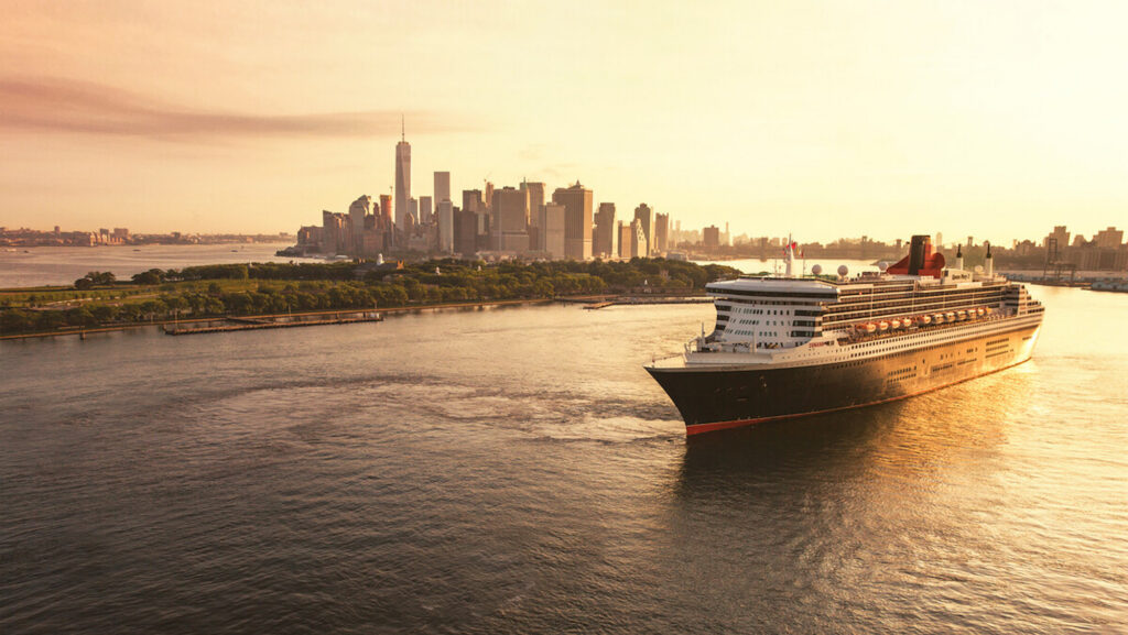 Cunard ship leaving New York City at sunset