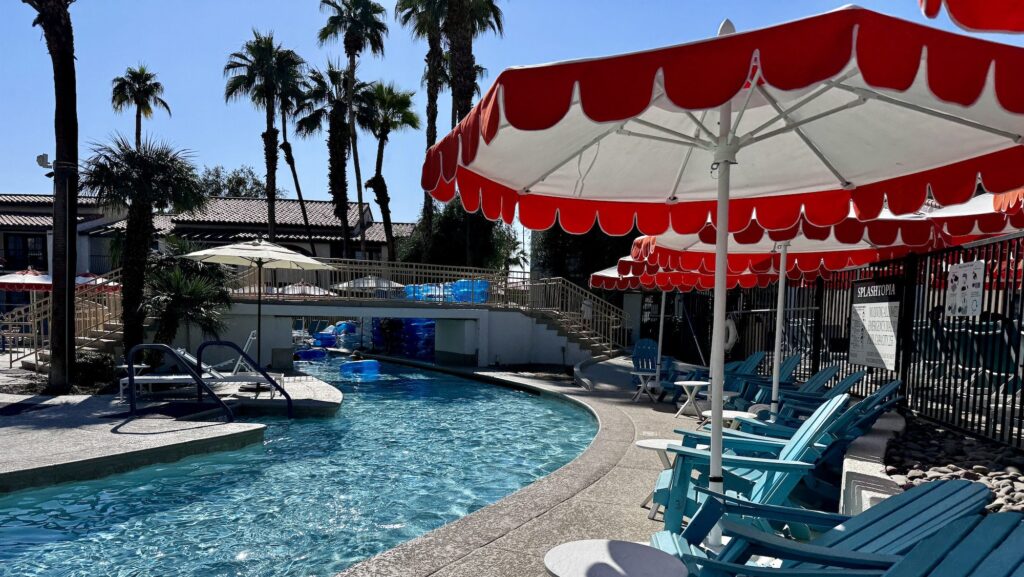 lazy river and chairs with umbrellas at the Omni Rancho La Puerta