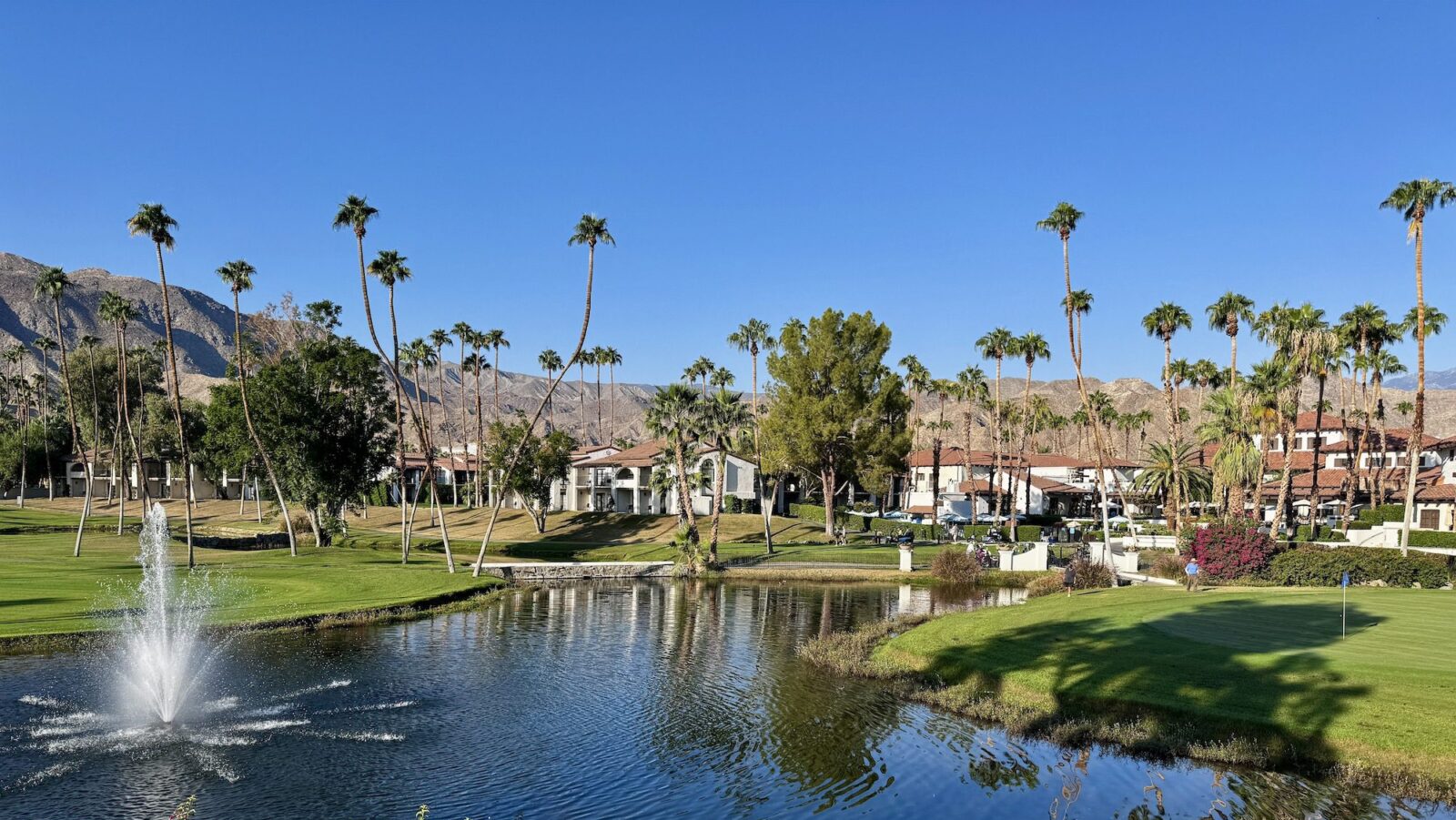 view of the golf course and fountain at Omni Rancho Las Palmas in Rancho Mirage