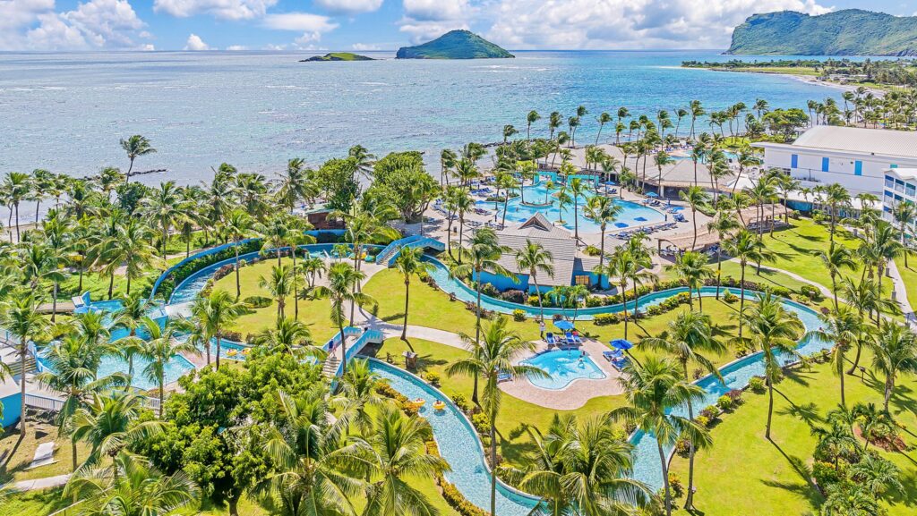 An aerial view of the lazy river, pool area, and beach at Coconut Bay Beach Resort & Spa
