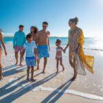 A multigenerational family walking on the beach at a Beaches Resorts property