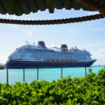 Cruise ship docked in ocean on sunny day