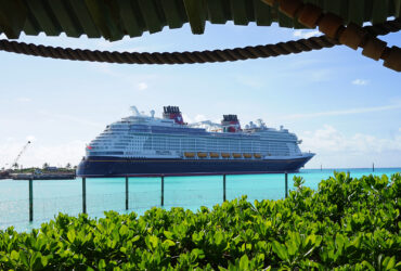 Cruise ship docked in ocean on sunny day