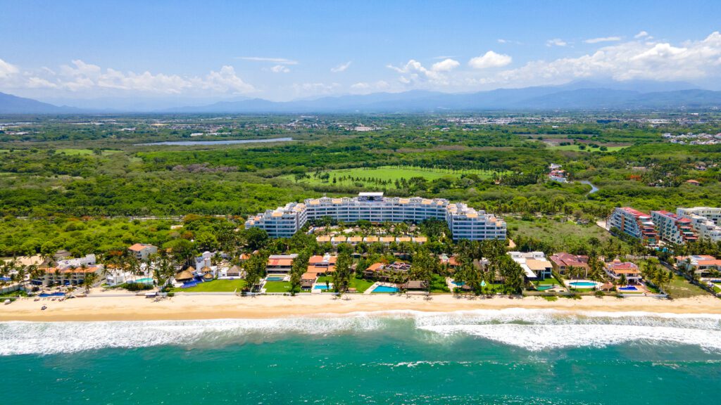 An aerial view of Marival Distinct All-Suites & World Spa and its beach area