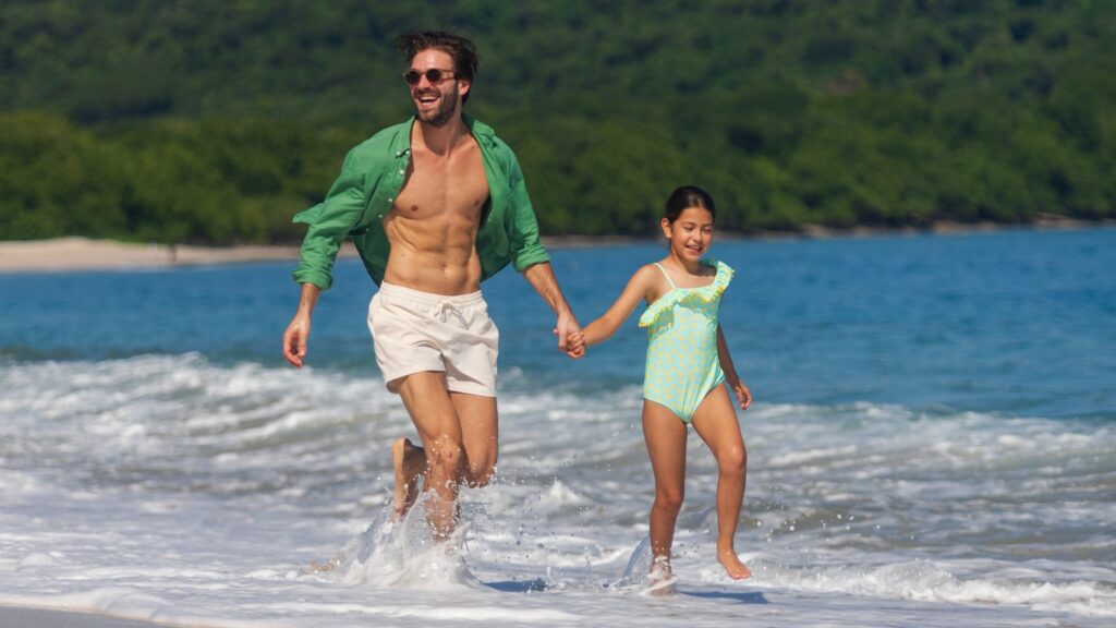 A father and daughter at the beach at The Westin Reserva Conchal