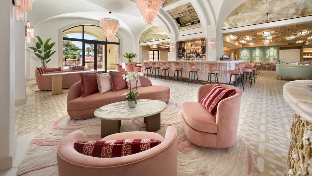 The lobby and bar area of the Palm House, done up in shades of pink and green