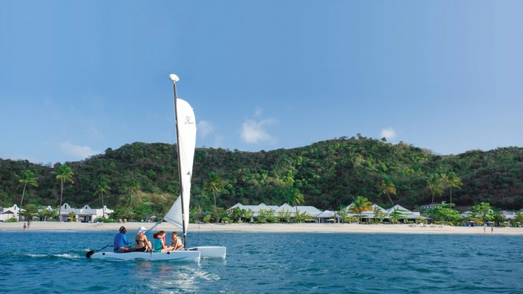 Kids and adults on a sailboat at Spice Island