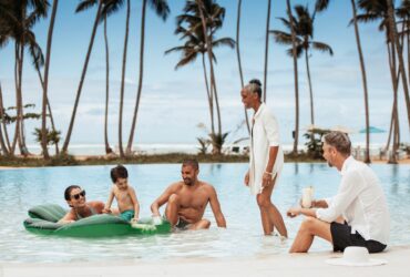A multigenerational family hanging out in the pool at Club Med Miches Playa Esmeralda