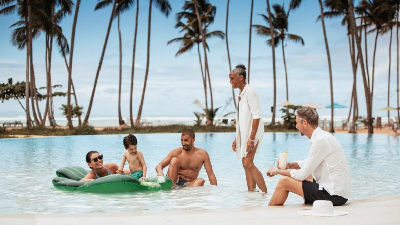 A multigenerational family hanging out in the pool at Club Med Miches Playa Esmeralda