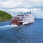 Riverboat going down a river