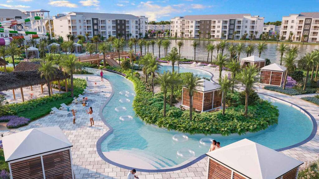 Lazy river at a resort, surrounded by cabanas, with buildings in the background