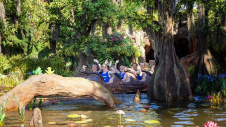 People waving from a water ride