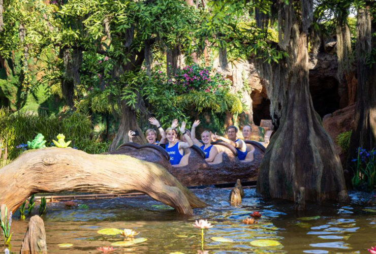 People waving from a water ride