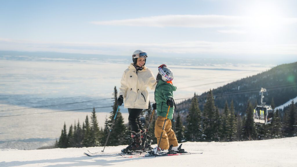 A mother and child on a ski slope at Club Med Québec Charlevoix